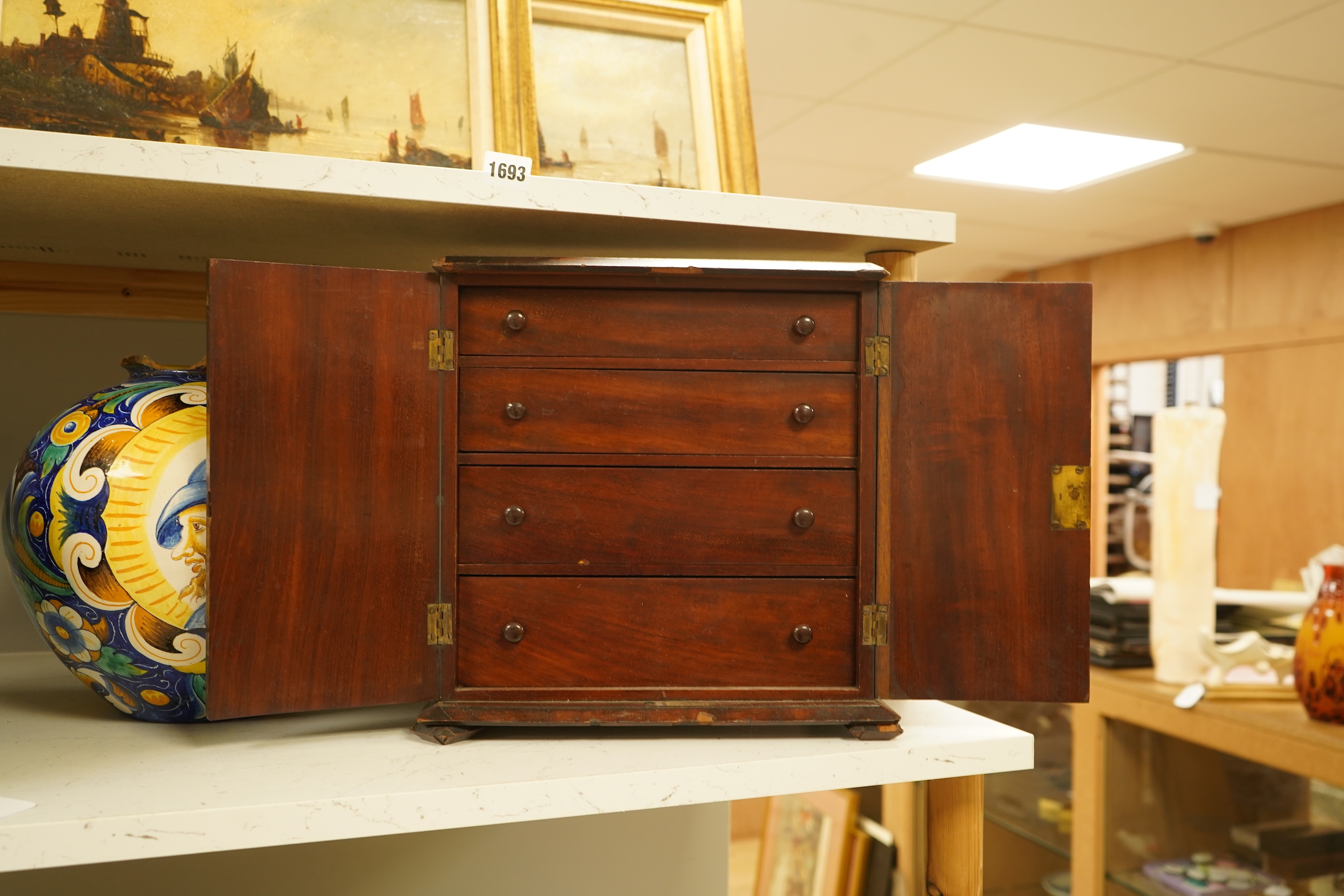 A late 19th century mahogany cabinet fitted with four drawers, 32cm high